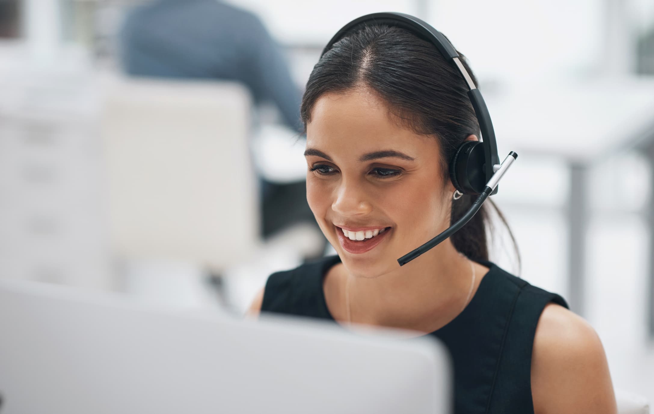 customer service representative smiling on the phone